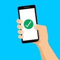 Hand hold smartphone with ÃÂheck mark. Operation ok. Success concept